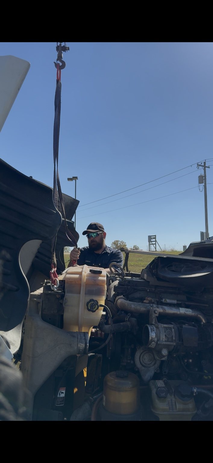 Jordan performing roadside repair at Road Ranger